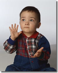 infant boy clapping